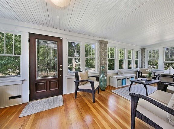 Front Door view of the Enclose Porch, used most of the year.  Super great space and view of lovely M