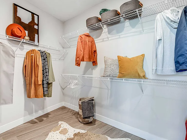 Enjoy generous storage space with expansive walk-in closets at The Wright, thoughtfully designed with built-in shelving and hanging space to help keep your home organized.