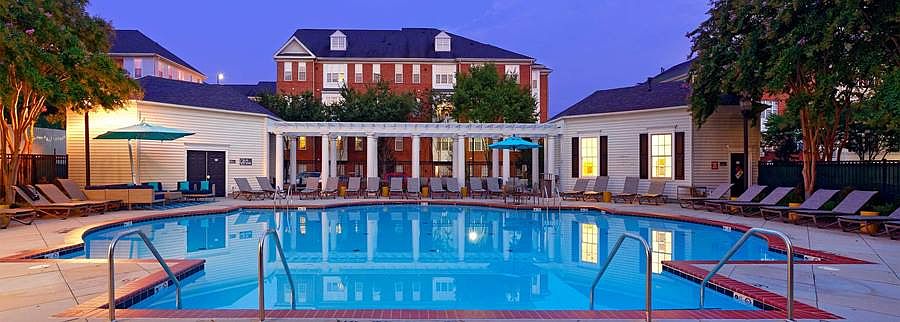 Courtyard with swimming pool, sundeck with lounge seating