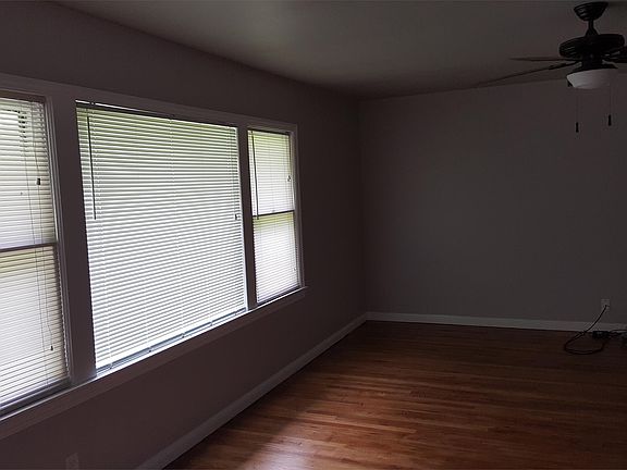 Large windows providing lots of natural light in living room with a vew to the backyard.