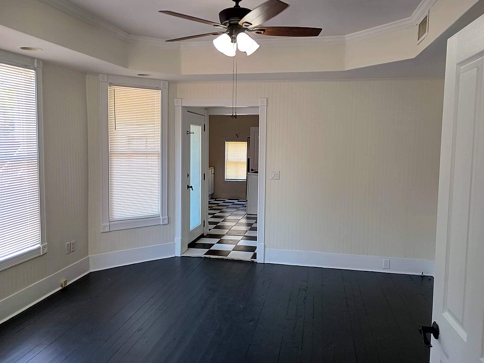 West living room and hallway into dining room and kitchen