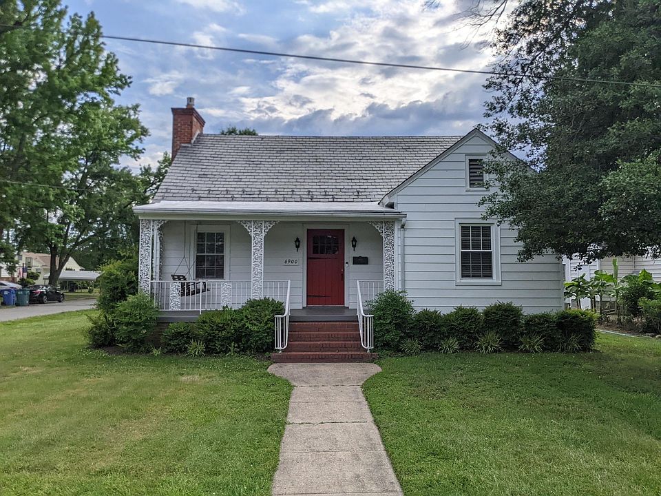 Front of the home, slate roof, porch swing!