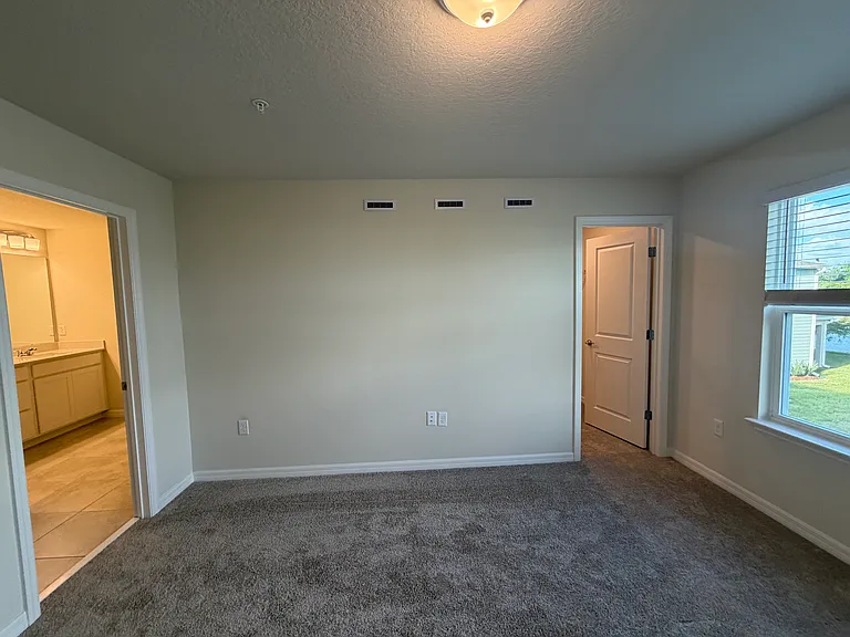 Dual Comfort: En-Suite Luxury Bath & Massive Walk-In Closet