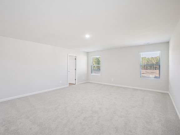 Primary bedroom in the Taylorsville floorplan at a Meritage Homes community in Garner, NC.