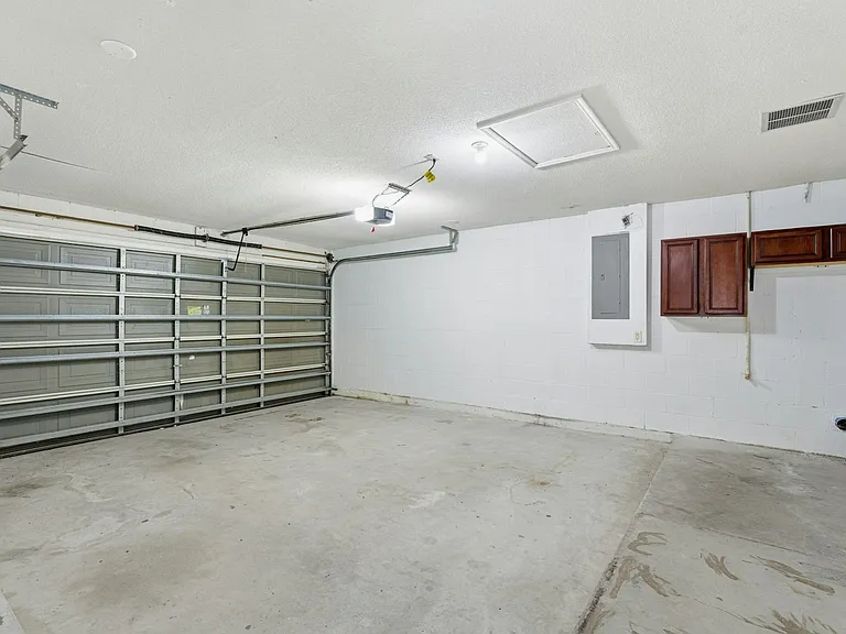 Garage with 14ft x 7ft door & laundry hook ups