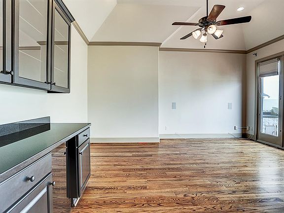 Fourth floor: a view of the game/media room as seen from the entry. Dry bar with wine fridge located to the left.