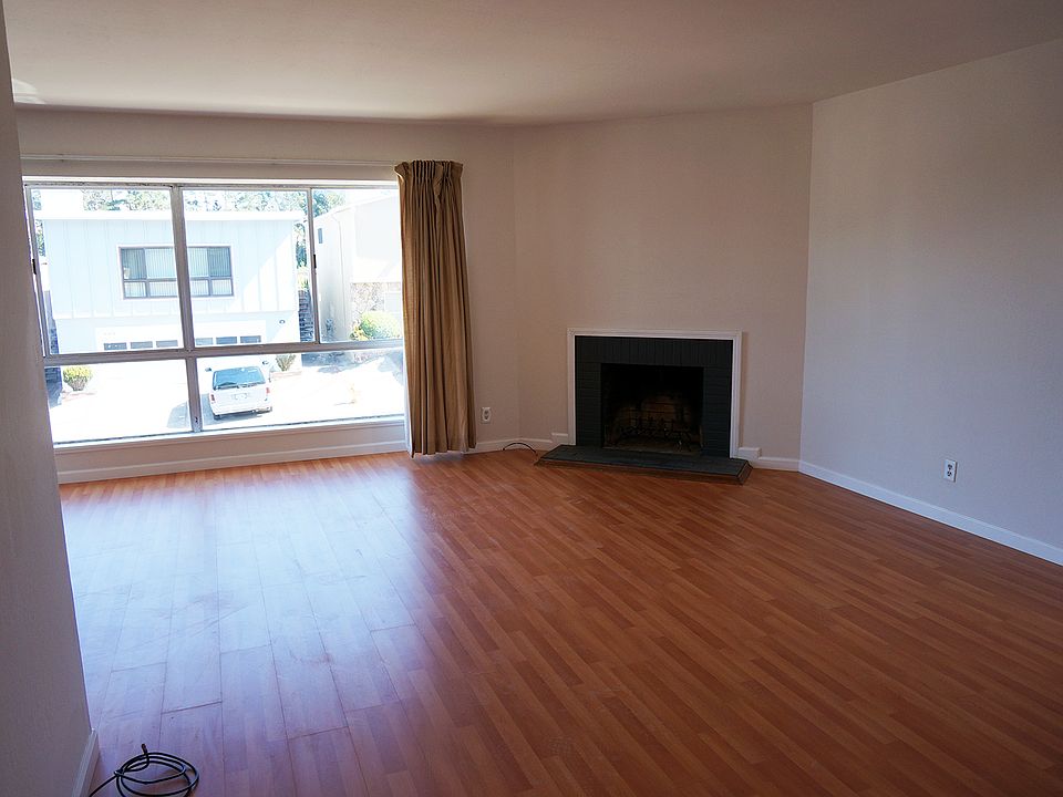 Spacious living room with working fireplace.