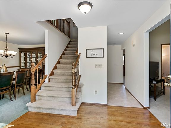 Foyer with dining room to left, living room to right, and kitchen straight ahead.