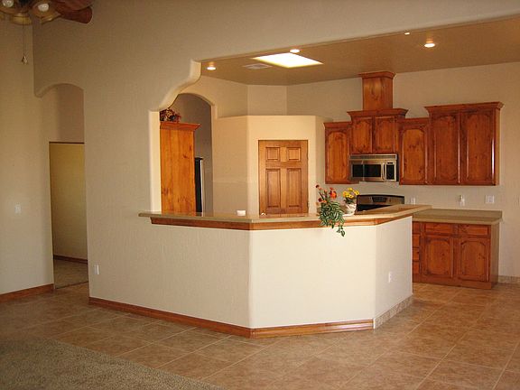 Kitchen with open floor plan & skylights