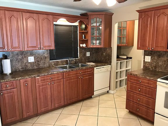 Large kitchen featuring walk-in pantry with prep counter and great storage