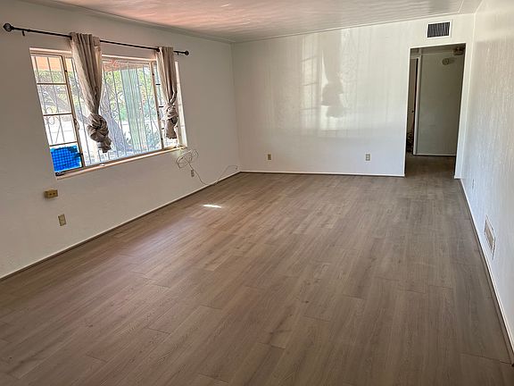 Living Room (view towards hallway to main bathroom and bedrooms)