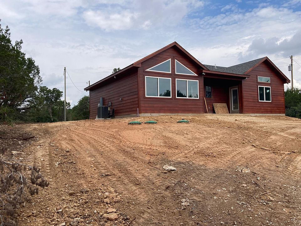 Rear view of cabin from right center of back yard
