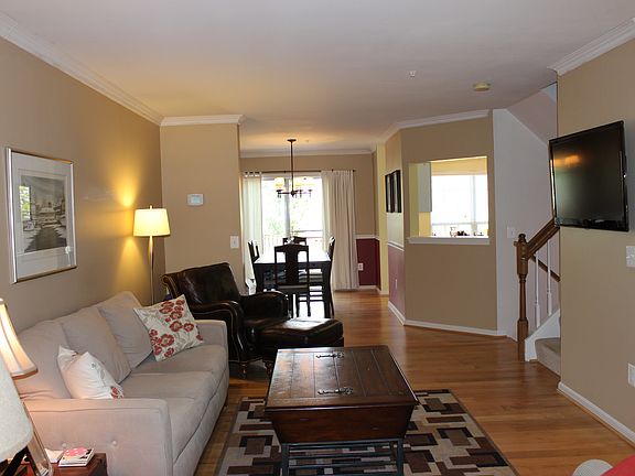 Living room and dining room view towards back