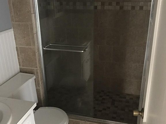 Updated bathrooms to include custom tile showers.