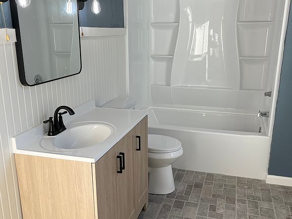 First Floor Bathroom, tile floor. New Vanity/toilet and surround