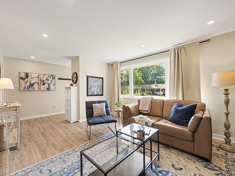 Bright, open-concept living area with comfortable seating_the perfect space to unwind or host collea