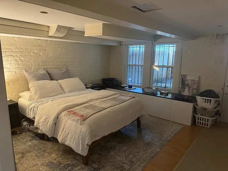 Lowest level BR w/ W/D unit and walk-out to patio. Lots of closet space.
