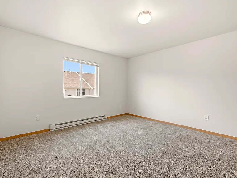 Step into the bright and airy interiors of Paramount at the Bluffs Apartments. This spacious room offers ample natural light and a cozy ambiance, perfect for your personal touch. Secure your ideal home today and schedule a tour!