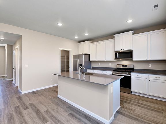 The open layout is highly sought after and has the kitchen open to the family room