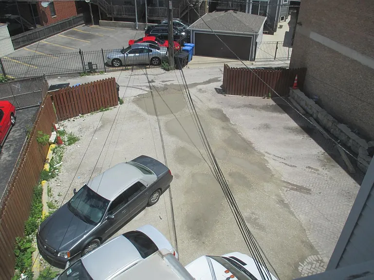 12-car surface parking lot at rear of site