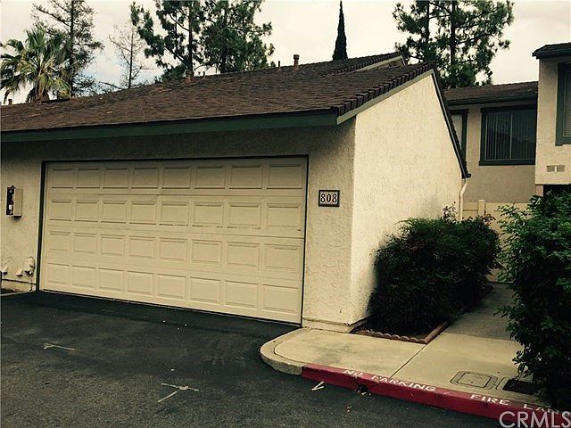Front of unit shows sidewalk that leads to front patio.