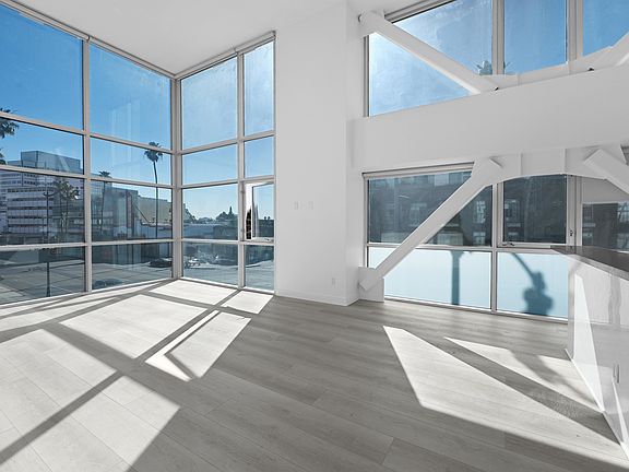 Experience breathtaking views in this modern loft with expansive windows.