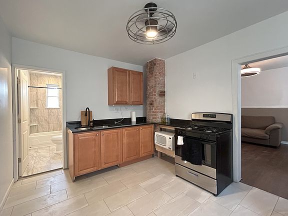 Upper Rear Unit Kitchen - additional shelving above sink and additional shelving above stove is being added soon.