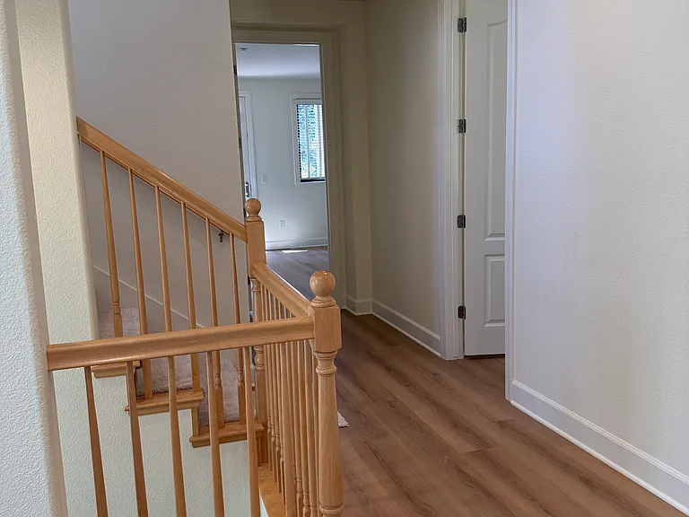 Hallway on second floor with 3 bedrooms at this level.