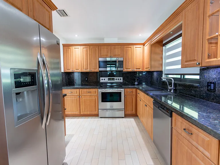 kitchen from "mud room"/additional storage room area.