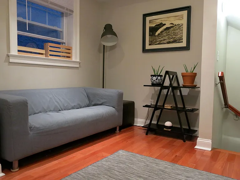comfortable ground floor living room with ample natural light