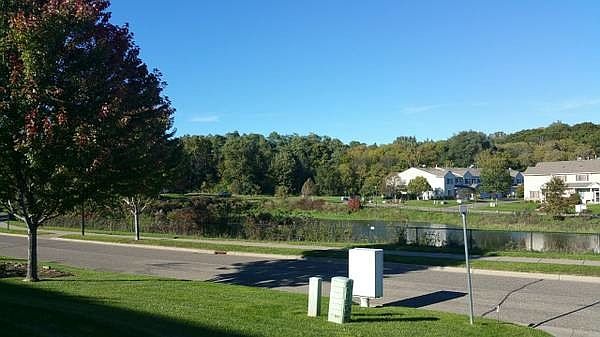 View of community, pond and access to Gateway Trail