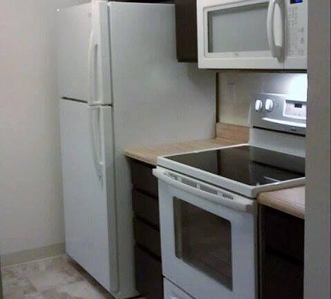 Kitchen 1 w/ fridge and stove