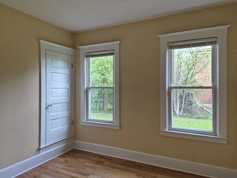 Master bedroom with view of both windows, and closet 2 of 2.