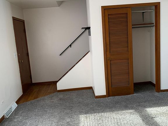 Front door, closet and stairs going upstairs