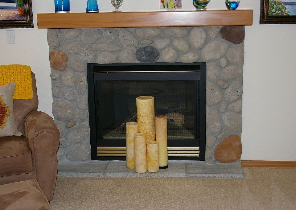 Stone gas log fireplace