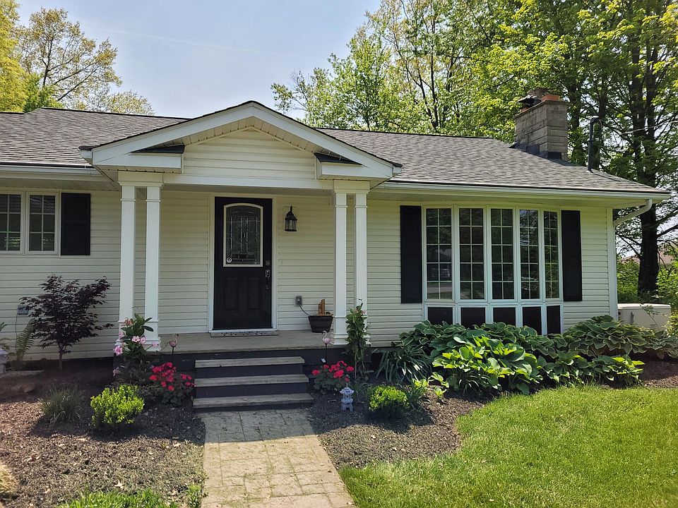 Front door entrance. New locks installed. Fresh water lily fountain on porch. Solar lighted flamingos and pagoda lanterns.