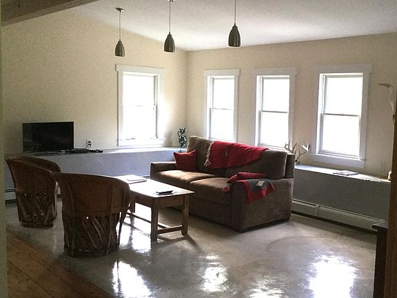 Living Room or Dining Room. great place for plants. Some tenants have a throw rug here. Dimmable lighting. Open concept floor plan.