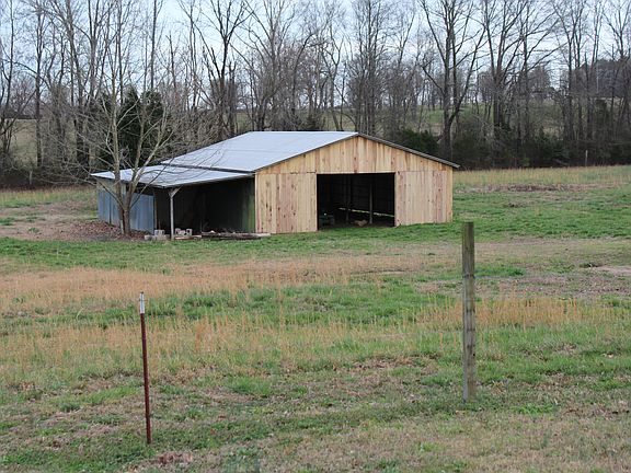 Barn in fenced pasture