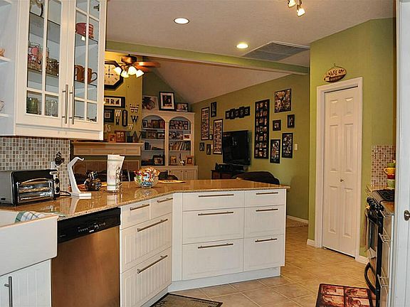 Upgraded farmhouse-style sinks, updated cabinetry - some with glass fronts!