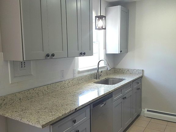 Newly updated kitchen with soft closing gray shaker style cabinets