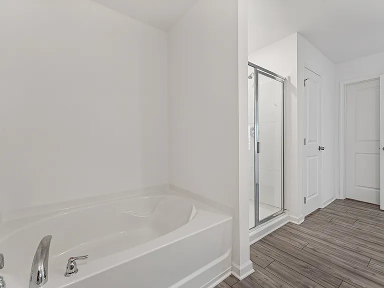 Primary bathroom with separate tub and shower