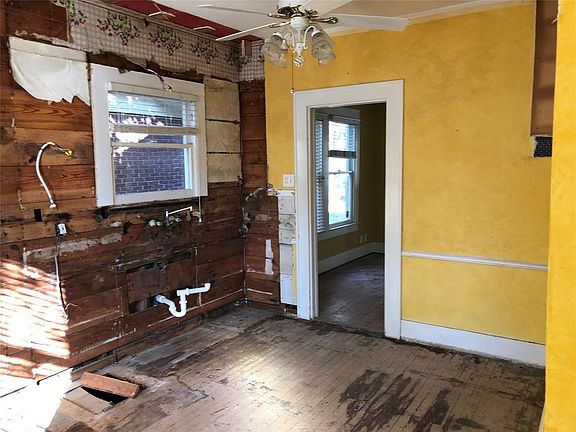 Original kitchen, which will now be the dining area. Open to the living room and kitchen.
