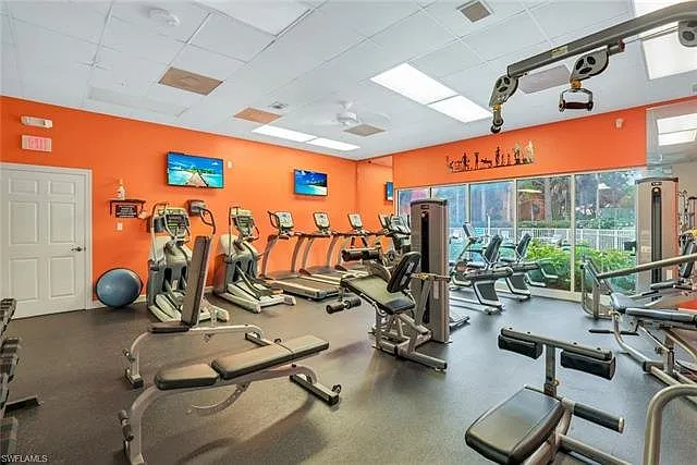 Stay active during your stay in the fully equipped fitness center, featuring cardio machines, weight training stations, and stretching areas _ all overlooking the pool area, with TVs and natural light.