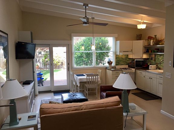 View outside is the orange tree and private, fenced yard