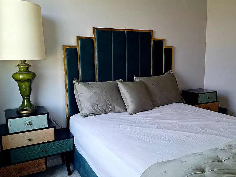 Unwind in the spacious primary suite featuring a comfortable king bed, stylish furnishings, and plenty of room to relax during your stay.