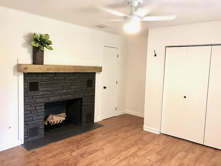 Master Bedroom (#3) with fireplace, double closet, single closet & window blinds. Fits a King or Queen bed. New modern ceiling fan with LED light with dimmer and variable speed fan.