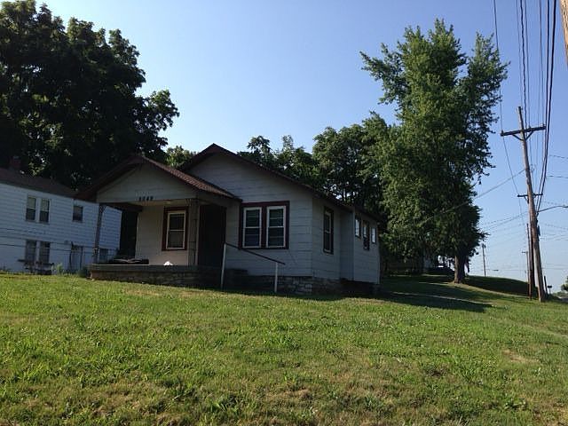 Front of house with patio