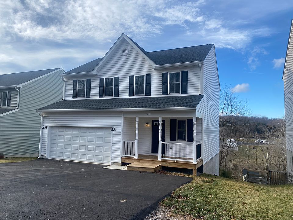 Front with 2 car garage & front porch