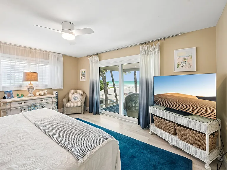 Primary bedroom/king bed with balcony and a view