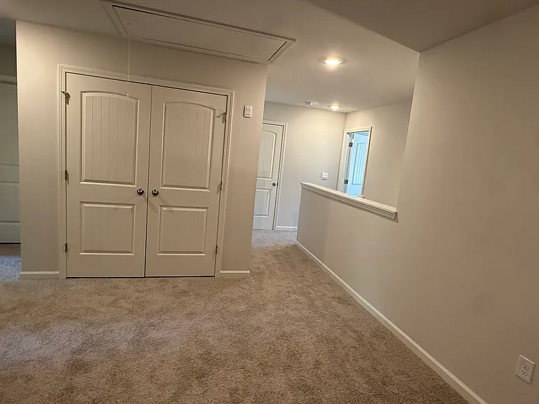 Big Loft with door to Washer and Dryer room with Washer and Dryer included